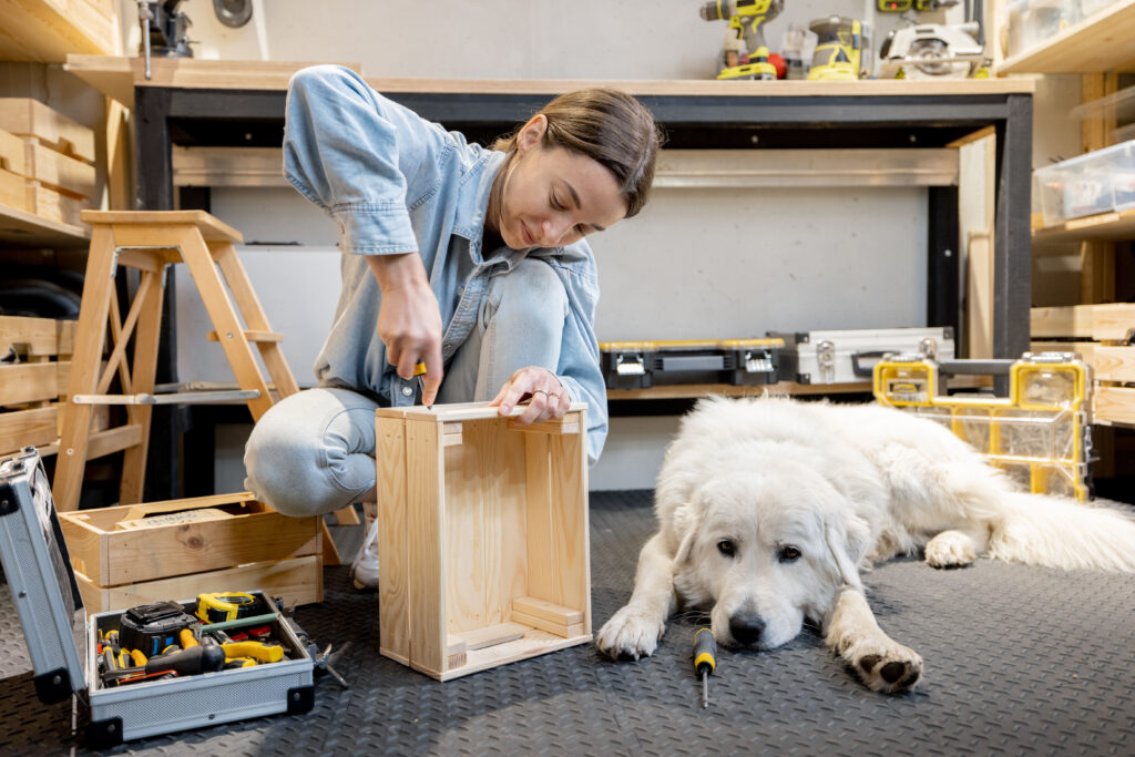 Woman reparing with a dog in the workshop